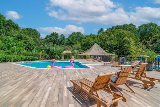 Affinitee at Pine Lake Apartments in Pine Lake, GA photo of a swimming pool with deck chairs around it
