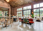Thumbnail 9 of 12 - Affinitee at Pine Lake apartment a restaurant with large windows and tables and chairs