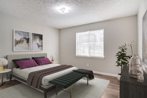 a bedroom with a bed and a window