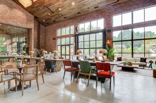 Affinitee at Pine Lake apartment a restaurant with large windows and tables and chairs