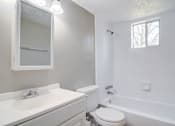 Thumbnail 7 of 12 - a bathroom with a sink toilet and a bath tub